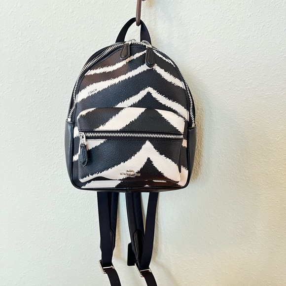 Coach Zebra MN CHRLE 39033 SV/BLACK
Coach Mini Charlie Women's Zebra Print EC - Picture 2 of 16